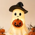 Cute Halloween ghost figurine wearing a witch hat and holding a pumpkin lantern light - With Lights
