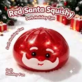 Giocattolo squishy Babbo Natale rosso glitterato in una festosa scena di neve - Babbo Natale (Con Fascetta Vaporiera)