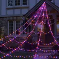 Detailed view of Halloween purple and orange LED spider web lights on house porch - Purple and Orange Glowing Web / 455 LEDs - Plug-in