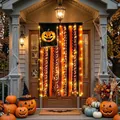 Halloween-Quastenbanner mit orange-schwarzen Bändern und LED-Leuchten im Detail - Mit Licht