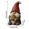 Detailed size of hand-painted resin gnome figurine with red hat and pinecone. - Pinecone Gnome