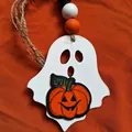Detailed view of a handcrafted wooden Halloween ghost ornament with an orange pumpkin - Ghost Pendant-Style B / Ghost Pendant-Pumpkin Style