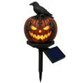 Dettaglio di una lampada solare a forma di zucca per Halloween con un corvo nero - Stile Zucca Corvo (G)