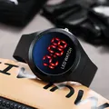 Macro detail view of a black children's LED digital watch with vibrant red display - Round LED Watch / Black