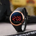Close-up of a digital LED watch with black strap and rose gold bezel - Round LED Watch / Rose Gold