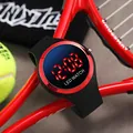 Close-up view of a stylish black and red LED digital sports watch for kids and students - Round LED Watch / Red