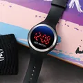 Close-up detail of a stylish black LED digital watch with red display for kids and students - Round LED Watch / Silver