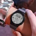 Detailed view of the digital sports watch with astronaut themed luminous display. - 955 Astronaut Grey