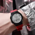 Close-up of a digital sports watch with red silicone strap and astronaut dial display - 955 Astronaut Red