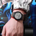 Close-up of the luminous digital sports watch with astronaut dial on wrist - 955 Astronaut Coffee