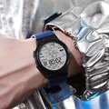 Detail view of a digital sports watch with astronaut dial on a person's wrist - 955 Astronaut Blue