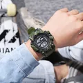 Outdoor men's camouflage digital sports watch worn on wrist in lifestyle setting. - Camo Green