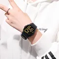 Stylish black LED sports watch for students featuring a large gold digital display screen - Black