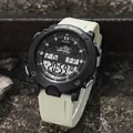 Detailed close-up of a rugged digital sports watch featuring a black dial and beige strap - Apricot