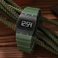 Detailed close-up of a square digital watch with green silicone strap on rustic rope. - Army Green