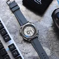 Detailed view of a multi-function digital sports watch with grey silicone strap - Gray