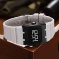 Close-up detail of the white silicone strap and black square digital display on this sport watch - Gray