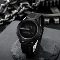 Close-up of a sleek black digital sports watch with a rugged mechanical gear background. - Black