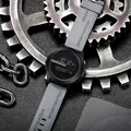 Detailed view of a tech-style digital sport watch on industrial gear background - Gray
