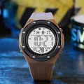Detailed view of a men's digital sports watch with a brown silicone strap and bezel. - Coffee