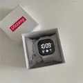 Close-up view of a minimalist white digital watch with astronaut icon in a gift box - Square Set (With Bracelet) / Gray