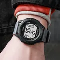 Teenager sports digital watch with black dial and grey strap shown on a male wrist - Gray