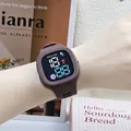 Square LED digital watch for kids featuring a brown silicone strap and cartoon astronaut icons. - Coffee