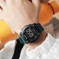 Waterproof digital sports watch with teal silicone strap and backlit digital display screen - Dark Green