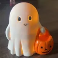 Détail d'une figurine de fantôme d'Halloween en résine avec un panier citrouille - Fantôme Avec Lumière