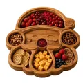 Detailed top-down view of Christmas themed wooden divided snack tray filled with food - Santa Claus
