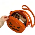 Detailed view showing the internal storage capacity of an orange Halloween pumpkin handbag. - Bright Orange Pumpkin Face (Style A)