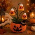 Handmade crochet pumpkin pot with smiling ghost flowers for cozy Halloween home decor - Candy Corn Style