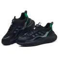 Close-up of lightweight steel toe safety shoes with breathable mesh and green accents - 35 / 7011 Black Flyknit