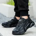 Detalle de zapatos de seguridad negros aislados y transpirables con puntera de acero - 36 / Negro (718)