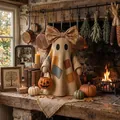 Detailed view of a rustic patchwork ghost Halloween doll with a floral bow and pumpkin basket - Patchwork Ghost Ornament (Without Light)