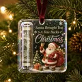 Detailed close-up of an acrylic Christmas money holder ornament hanging on a tree - Santa Claus
