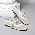 Detailed view of cream white French vintage Mary Jane mesh ballet flats with gold buckle - 35 / Off White