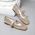 Exquisite detail view of champagne mesh Mary Jane ballet flats with metallic buckle straps. - 35 / Gold