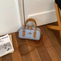 Premium light blue denim Boston handbag with brown faux leather handles and strap - Brown