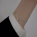 Elegant silver-toned geometric pull bracelet featuring a polished round bead charm - Adjustable Drawstring Round Bead Pendant Style (MY35526)