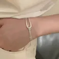 Minimalist silver geometric pull-through bracelet with adjustable chain for women. - U-Buckle Pull-out Style (MY35633)