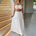 White two-piece vacation set featuring a ruffled crop top and tiered maxi skirt. - S / Top And Bottom / White
