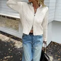Chic white cable-knit zip-up cardigan sweater for women in a street style setting - S / Tops / White