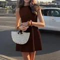 Elegant brown sleeveless round neck mini dress with flared hem and structured fit for summer - S / Brown
