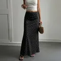 Elegant black satin midi skirt with white polka dots for a chic and stylish summer look - S / Bottoms / Black