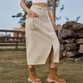 Detail shot of a washed khaki cargo denim midi skirt featuring a front slit and drawstring. - S / Bottoms / Light Khaki
