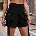 Detailed view of women's black denim cargo shorts with utility pockets and D-ring straps. - S / Bottoms / Black
