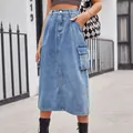 Detail view of light blue denim midi skirt featuring cargo side pockets and high waist. - S / Bottoms / Denim Blue