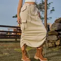 Detailed view showing the drawstring adjustable hem and cargo pockets of the skirt - S / Bottoms / Light Khaki