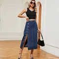 Full body view of a chic high-waisted denim midi skirt with front buttons and a stylish slit. - S / Dark Blue